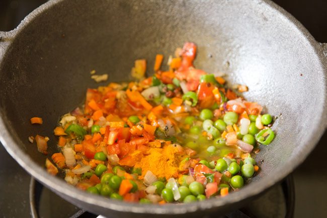 turmeric powder added to pan. 