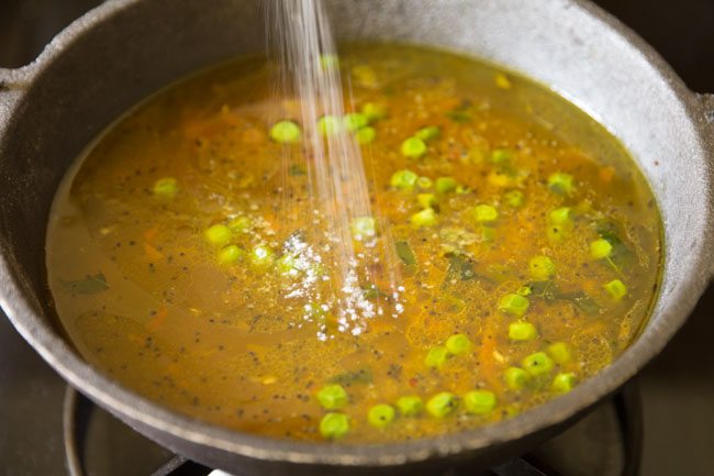 adding salt to pan. 