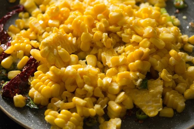 boiled corn kernels added to the pan. 