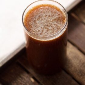 wood apple juice in a glass.