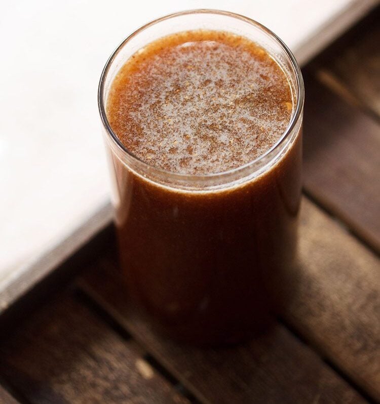 wood apple juice in a glass.