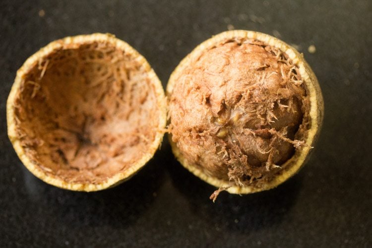 wood apple fruit broken into half.