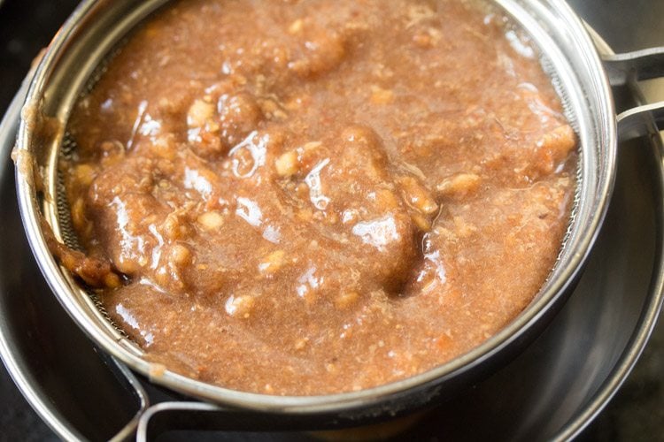 straining mashed pulp. 