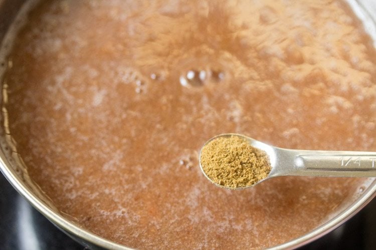 adding roasted cumin powder to strained pulp. 