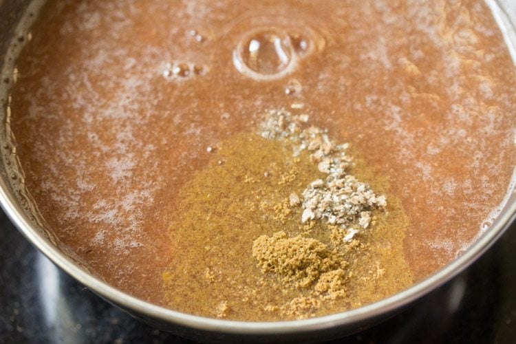 cardamom powder and black salt added to strained pulp for making wood apple juice. 