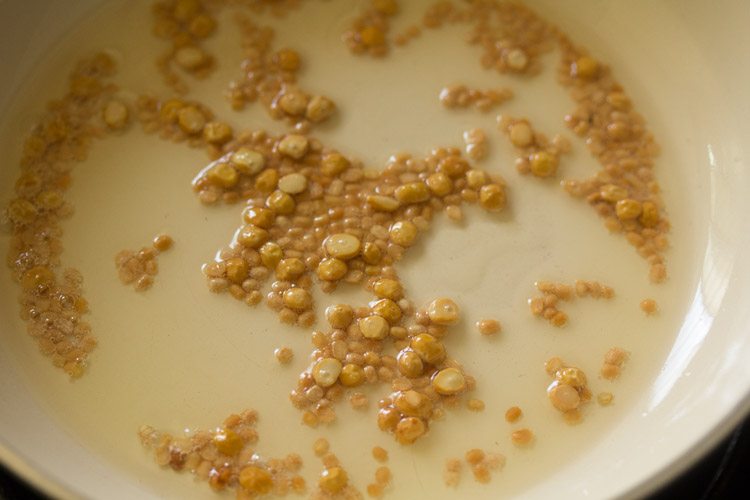 saute lentils in oil in a pan