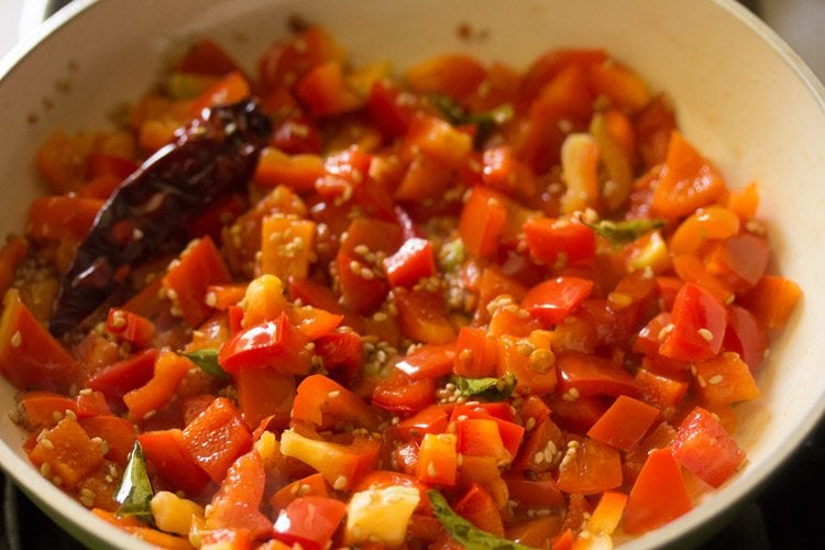 saute red capsicum in the pan