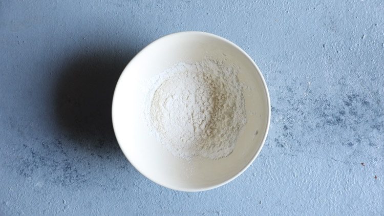 flour and cornstarch in a white mixing bowl