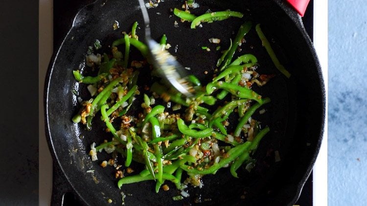 spoon mixing aromatics