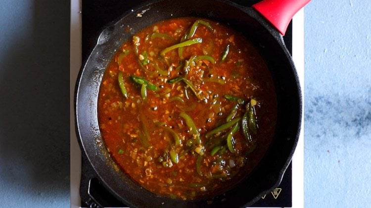 restaurant style chilli paneer sauce has thickened in the pan