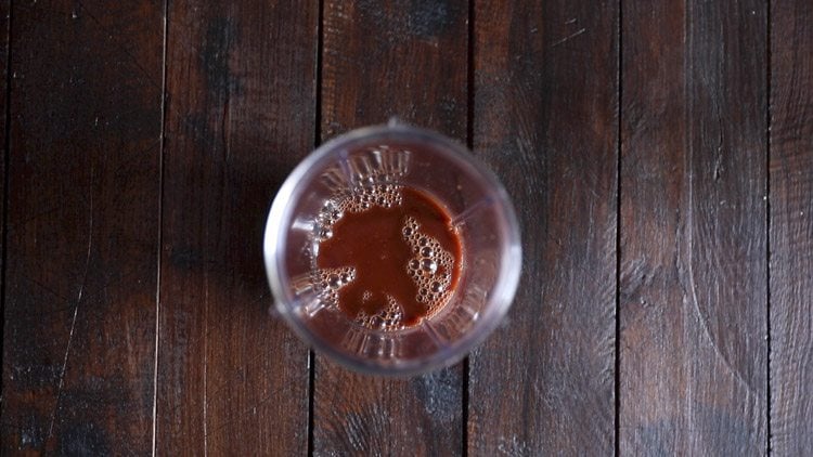 prepared cocoa solution added in a blender jar. 