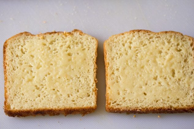 butter spread on two bread slices. 