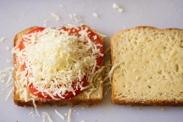 tomato slices topped with grated cheddar cheese. 