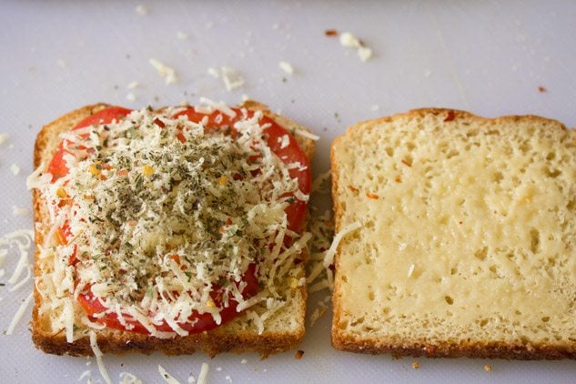 dried herbs, crushed black pepper and red chili flakes sprinkled on the cheese. 