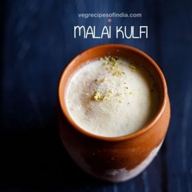 malai kulfi garnished with crushed pistachios and served in an earthen matka with text layovers.