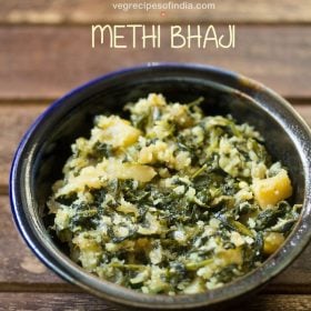 methi bhaji served in a ceramic bowl with text layovers.