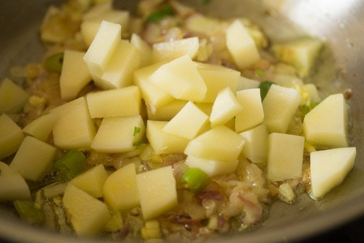 chopped potatoes to the pan. 