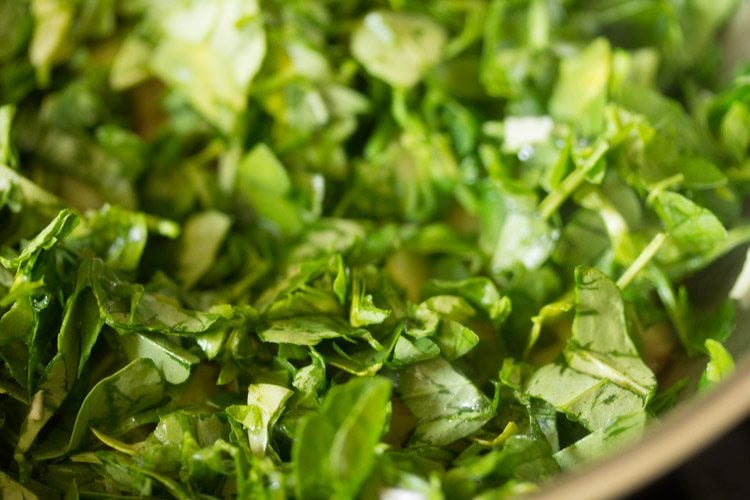 chopped methi leaves added to the pan. 