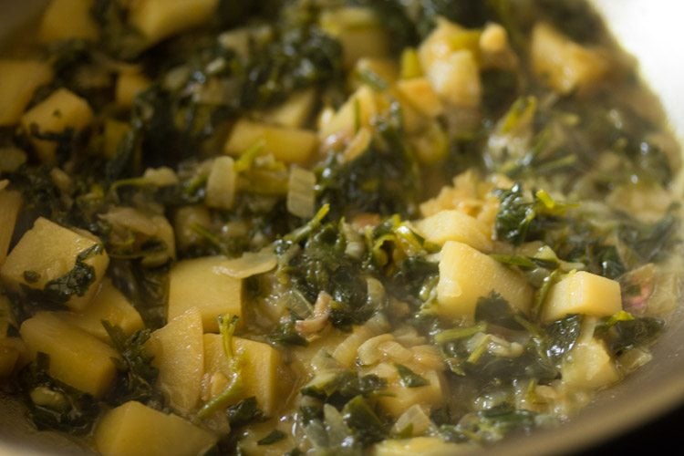 cooking methi bhaji. 