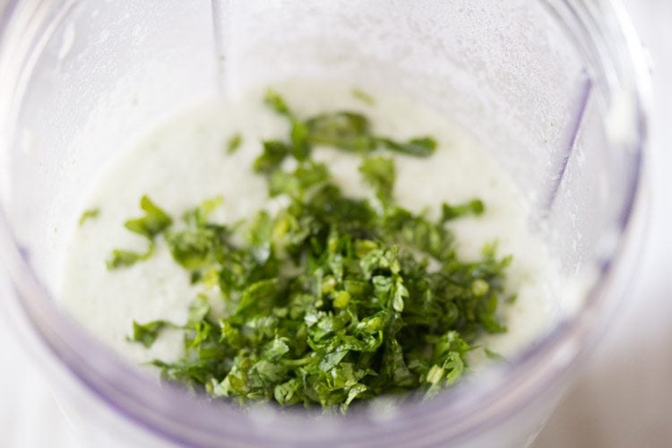 finely chopped coriander leaves added to sambaram drink.