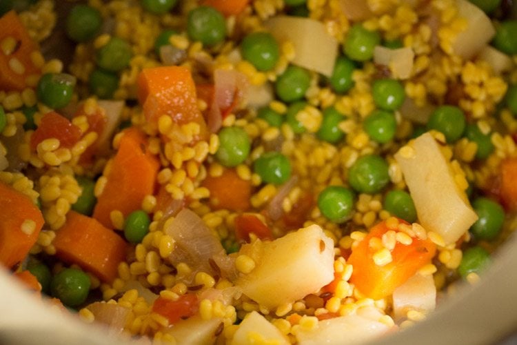 mixing lentils with veggies