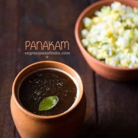 panakam garnished with a tulsi leaf and served in a earthen glass with text layovers.