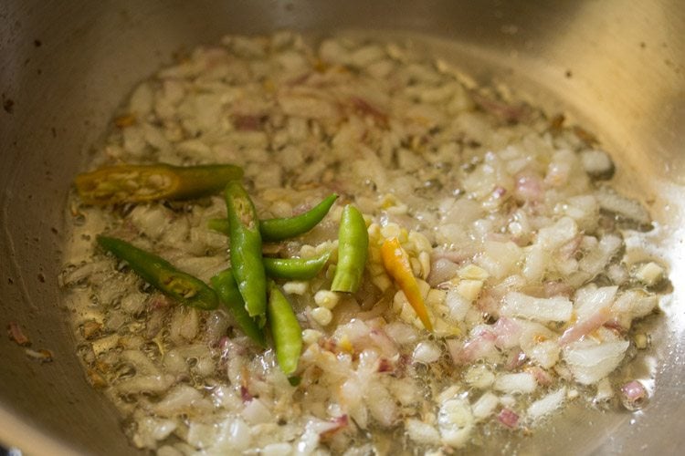 slit green chilies and finely chopped garlic added to the onions. 