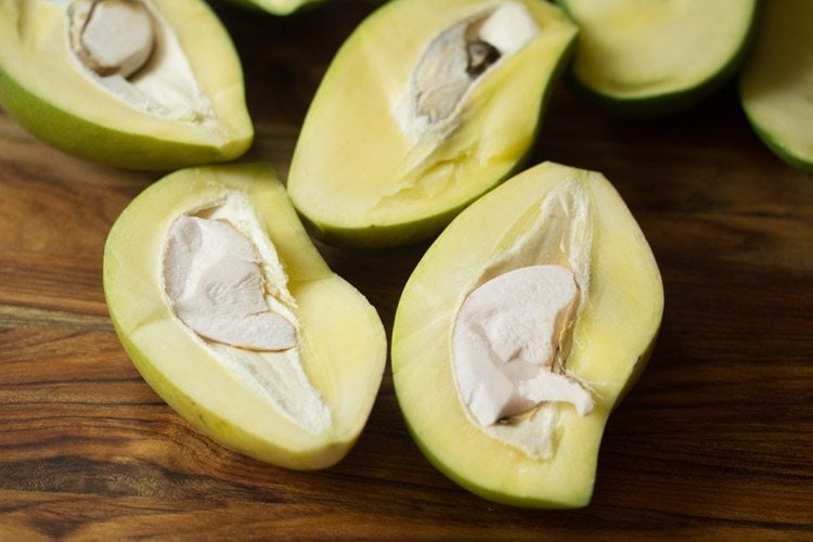 chopping unripe mangoes