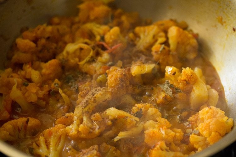 crushed dried fenugreek leaves and garam masala powder added to cauliflower curry. 