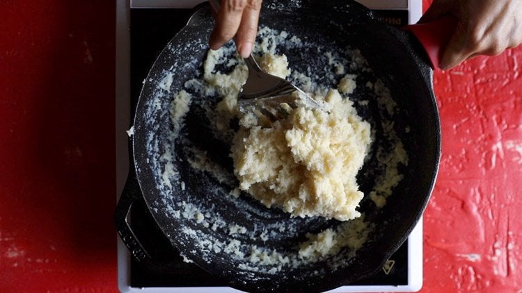 thick laddu mixture in skillet