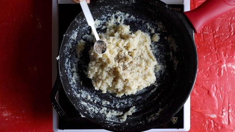 cardamom powder being added