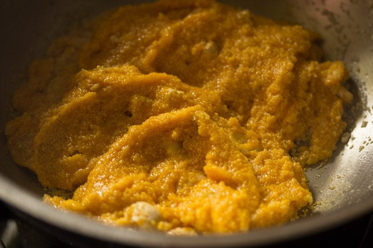 mixing mango puree with the roasted rava. 