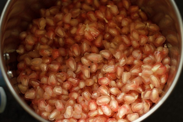pomegranate anar seeds added to blender bowl for making pomegranate juice