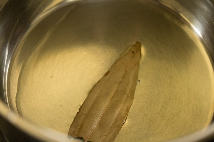 bay leaf in hot oil in a pan
