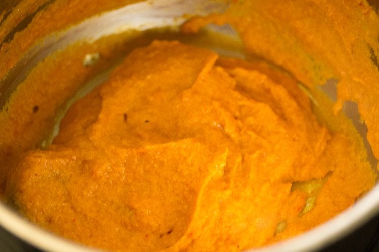 sautéing paste till oil releases from the sides of the pan