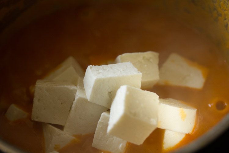 adding paneer cubes in the gravy