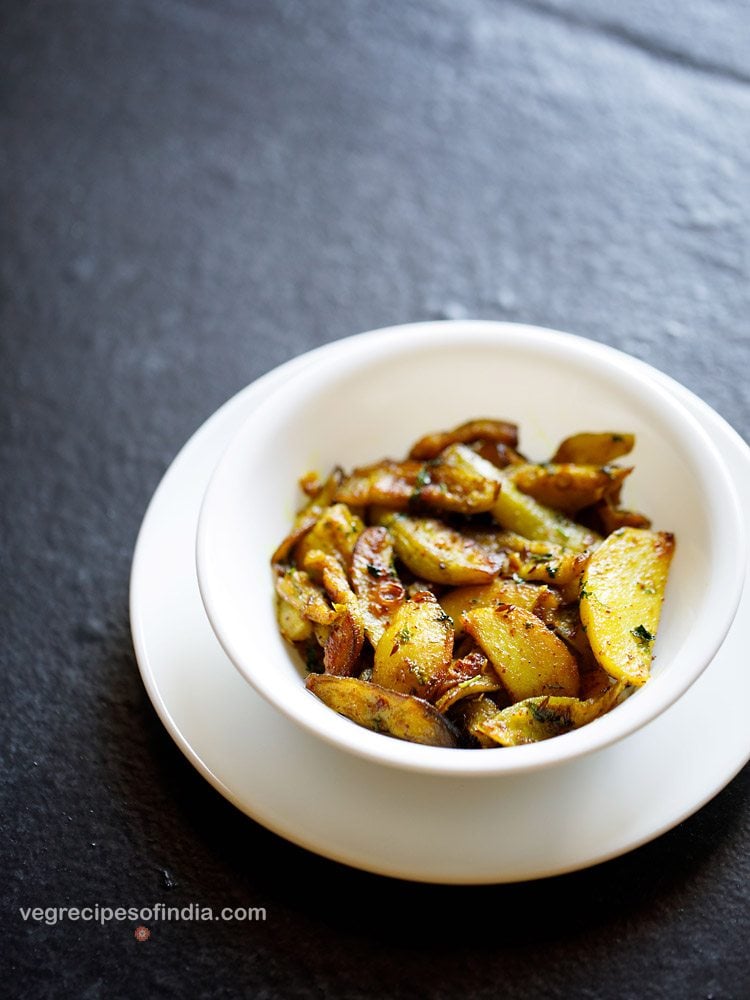 aloo parwal sabji served in a white bowl