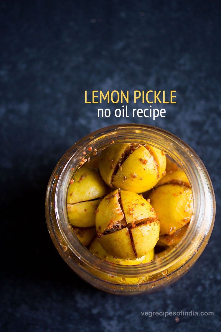 lemon pickle in a glass jar on a blue board