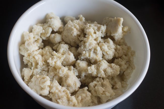 crumbled khoya in a bowl. 