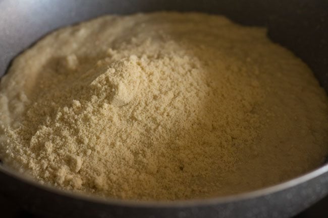 sugar added to the melting khoya in the pan. 