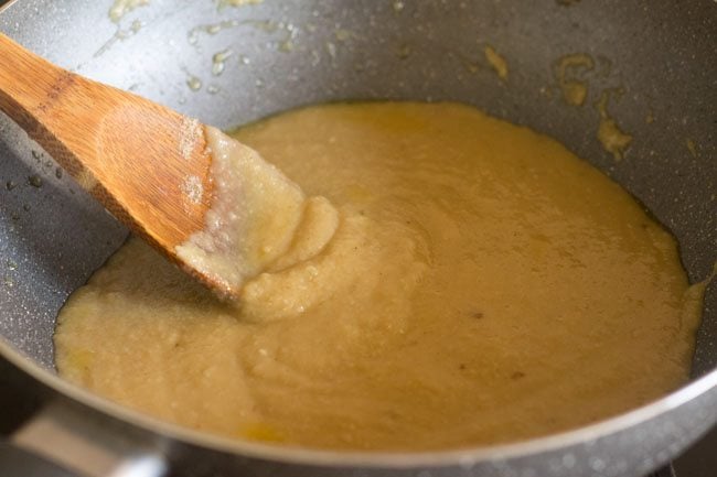 molten and liquid khoya-sugar mixture in the pan. 