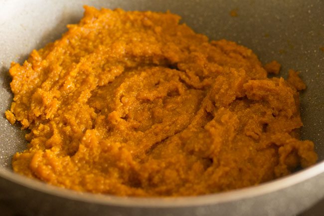 cooking the modak mixture in the pan. 