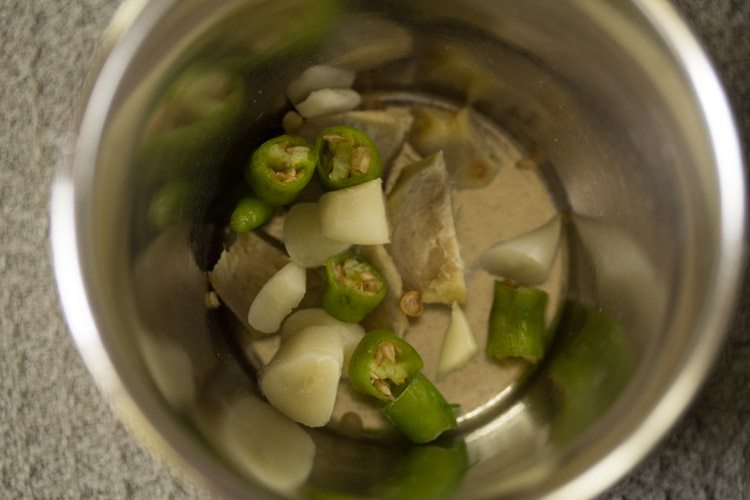 green chili garlic and ginger in a mortar pestle