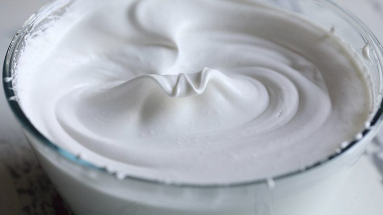 whipped cream at stiff peaks for making homemade ice cream recipe