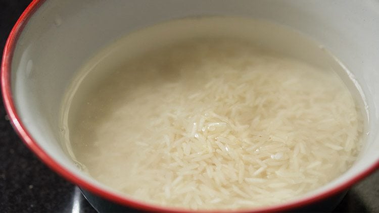soaking rice in a mixing bowl.
