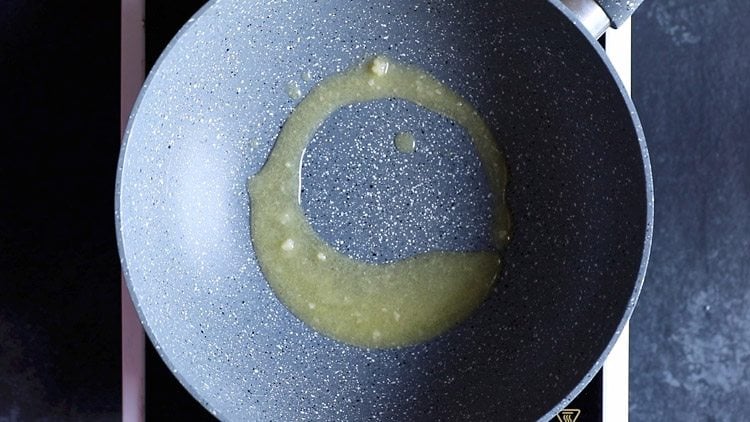 melting ghee in a pan.