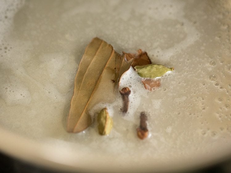 whole spices added to melted butter in pan. 