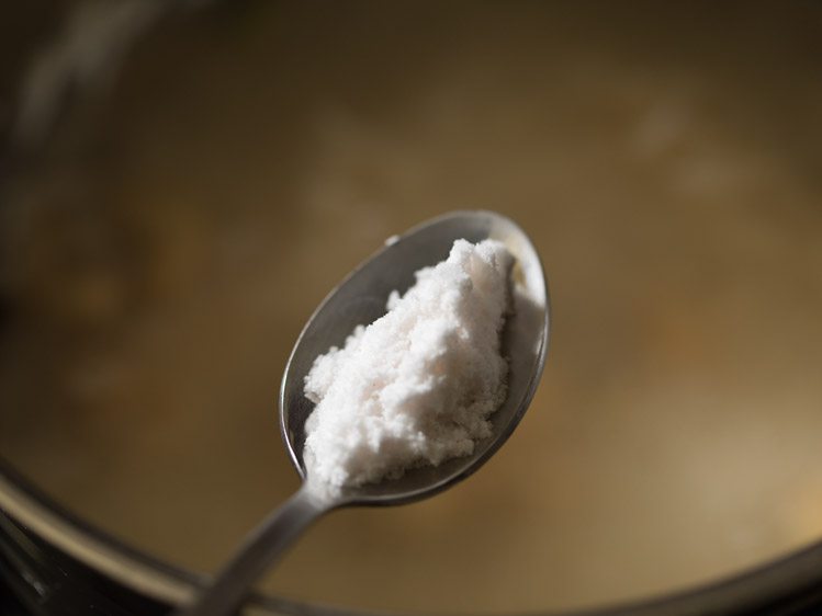 adding salt to butter rice. 