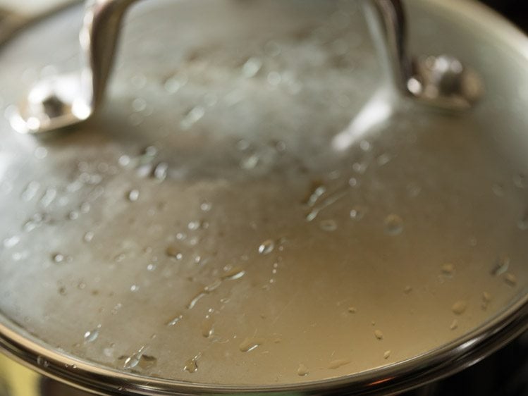 cooking butter rice in covered pan. 