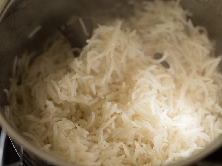 fluffing cooked butter rice. 